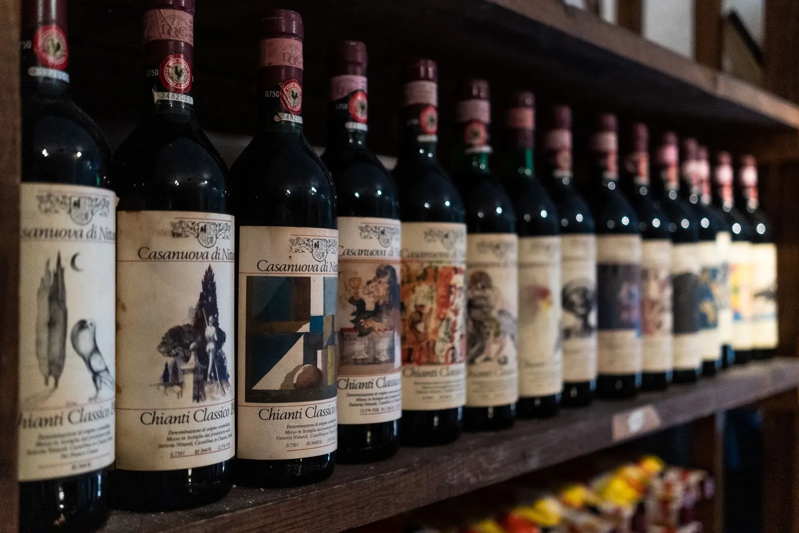 Bottles of Chianti Classico on a cellar shelf in Florence