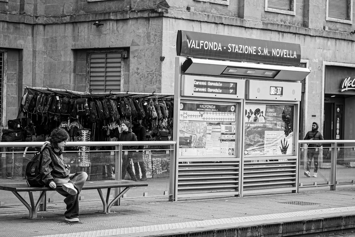 Travellers with luggage at Florence's main station