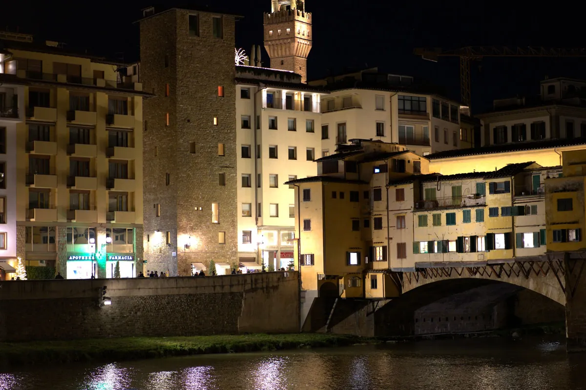 The Oltrarno by the river at night. Rasputin is a speakeasy with no sign, so we do not show its door